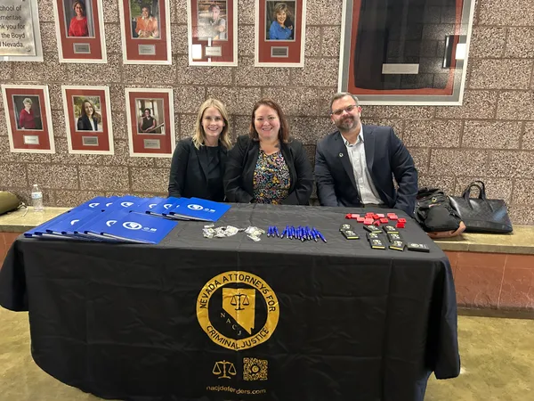 Continuing legal education symposium we set up a table to hand out notebooks and pens and encourage people to join our organization