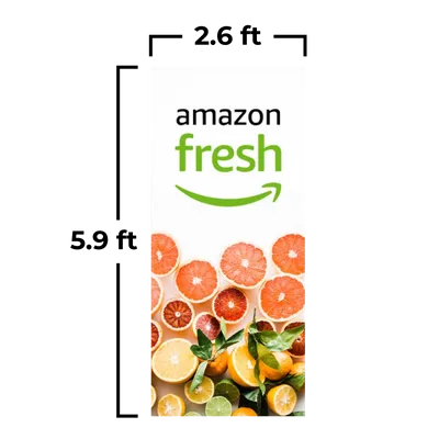 An advertising banner for 'Amazon Fresh' features a logo at the top and a vibrant selection of citrus fruit slices beneath it.