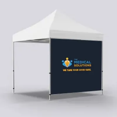 Full Front Wall Single Sided A custom-branded event tent with 'MEDICAL SOLUTIONS WE TAKE YOUR GOOD CARE' on its backdrop, likely for outdoor promotional or medical outreach activities.