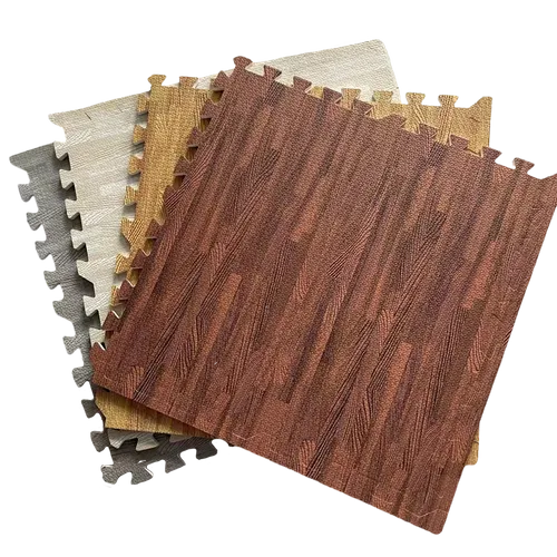 This image shows a collection of interlocking floor tiles with wood grain designs in various colors, overlapping each other.